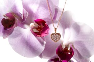 Jewelry Photography Lighting – Gold Pendant & Orchid Flower