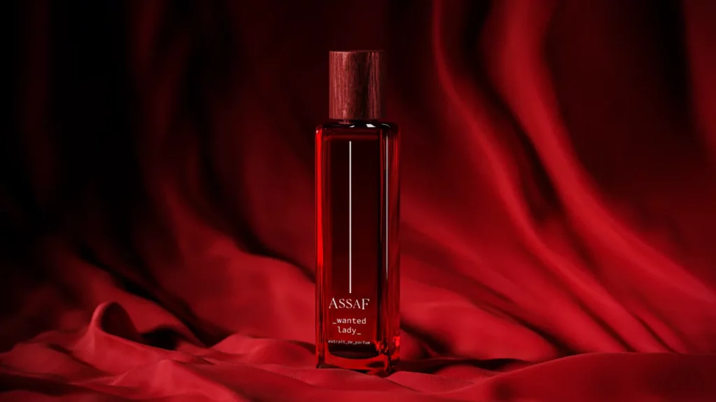 Perfume bottle of Wanted lady from Assaf on red fabric