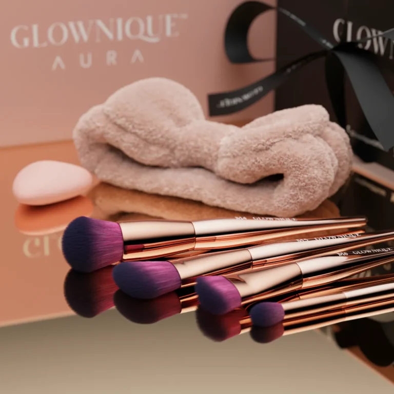 A luxurious rose gold makeup brush set from Glowique Aura, featuring elegant design and high-quality bristles for flawless application